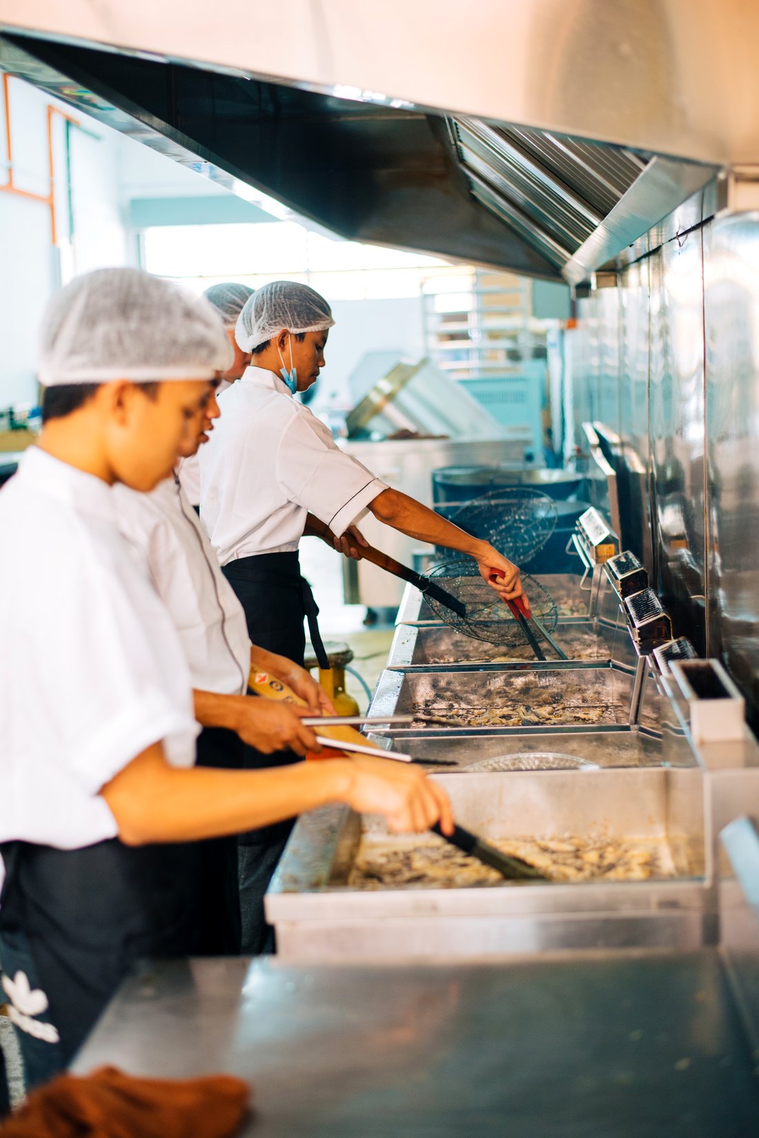 The Carlos kitchen — fish skin frying in open fryers